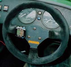 [Image: Sigma computer mounted on Seven steering wheel.]